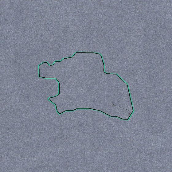 Snag, 75 by 57 mm, on blue-grey fabric